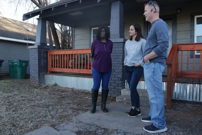 Left to right, Shelia Hawkins talks to Miranda and Michael Vaught outside the Oklahoma City home Hawkins rents from the couple.